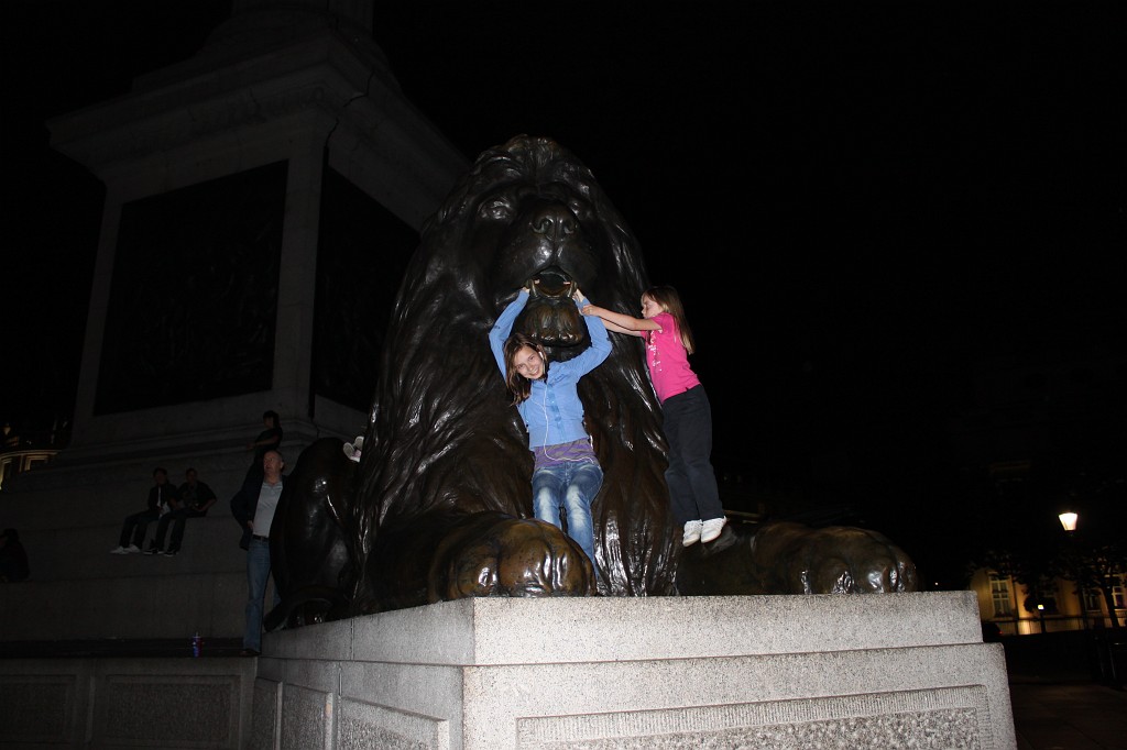 IMG_2462.JPG - Evelyn and Naomi on Trafalgar Square Lion  http://en.wikipedia.org/wiki/Trafalgar_Square 