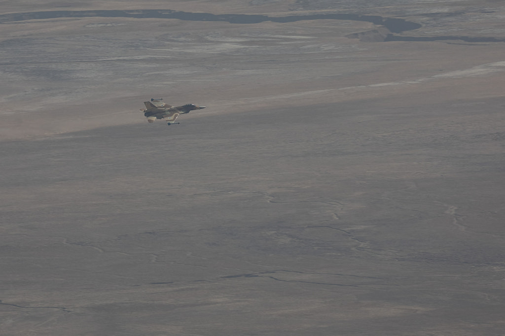 574A1402_c1.jpg - Israel air force F16 plane flying low over the  Judaean desert  near the  dead sea  seen from above from  Masada 