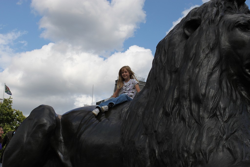 IMG_2303.JPG - Naomi on a  Trafalgar Square Lion  http://en.wikipedia.org/wiki/Trafalgar_Square 