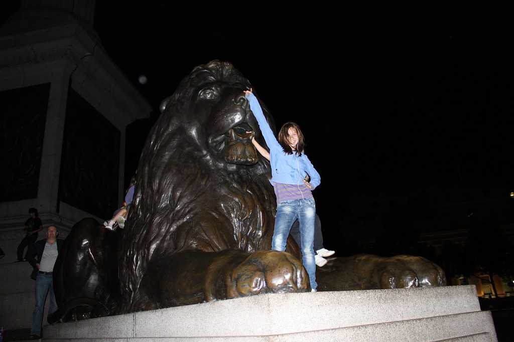 IMG_2463.JPG - Evelyn on Trafalgar Square Lion  http://en.wikipedia.org/wiki/Trafalgar_Square 