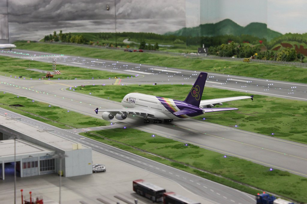IMG_5857.JPG - Thai Airways A380  Miniatur Wunderland  ( miniature wonderland ). The world largest miniature railway not only host trains but also running cars, trucks, ship and even "flying" airplanes.