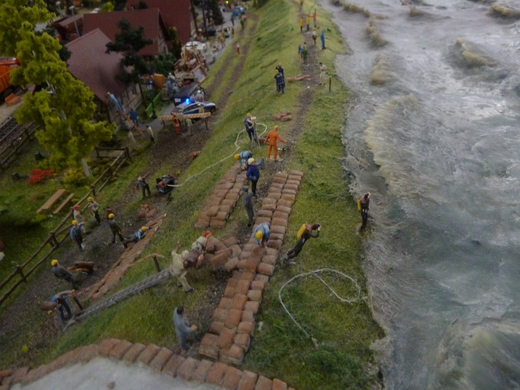 P1050449.JPG - Flood in the  Miniatur Wunderland  ( miniature wonderland ). The world largest miniature railway not only host trains but also running cars, trucks, ship and even "flying" airplanes.