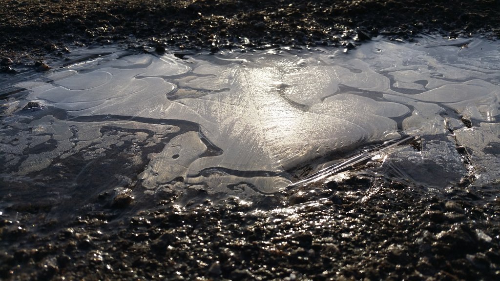 20150225_083845.jpg - Frozen puddle in the morning sun